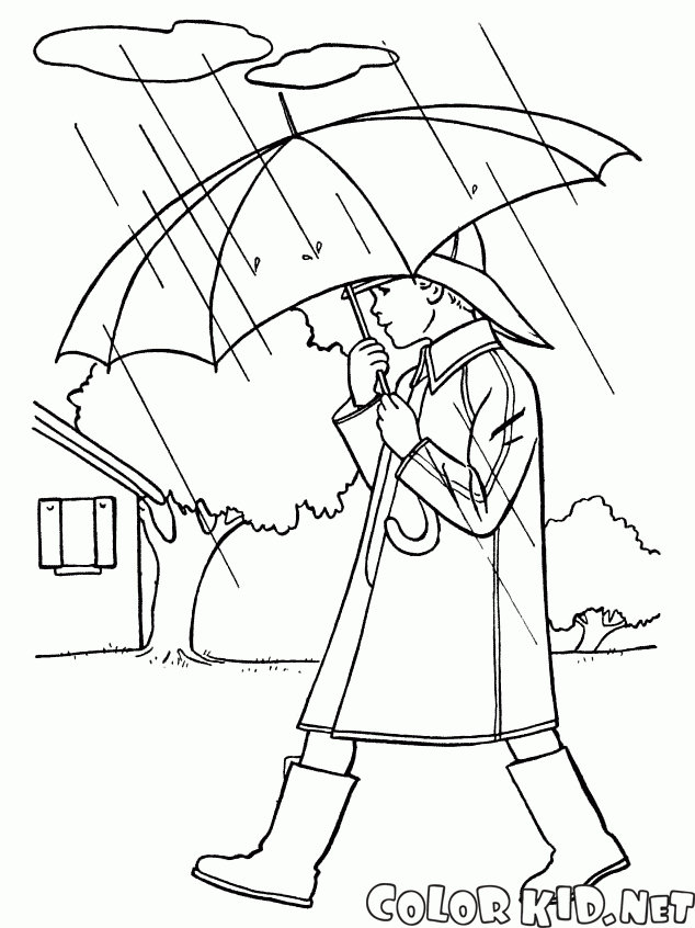 Der Junge ist zu Fuß in der regen